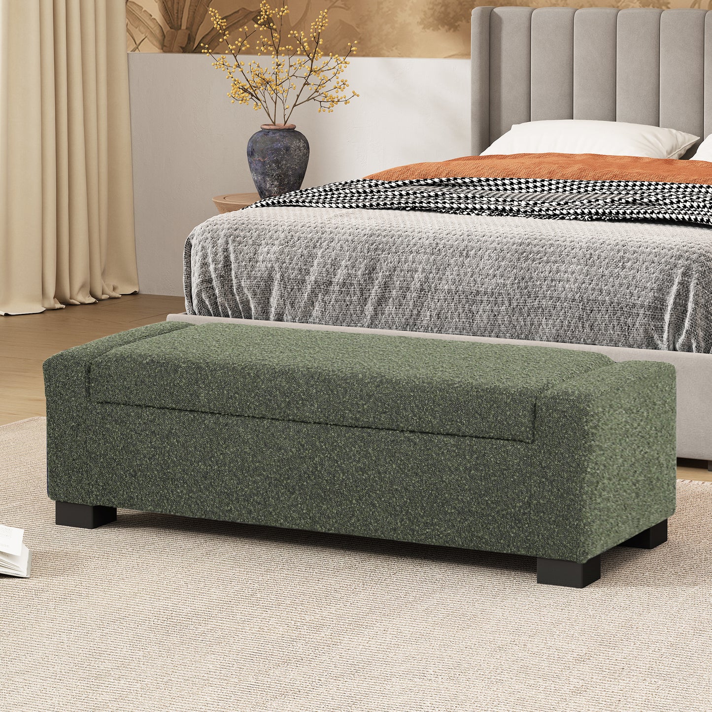 Dark green upholstered storage ottoman with black legs