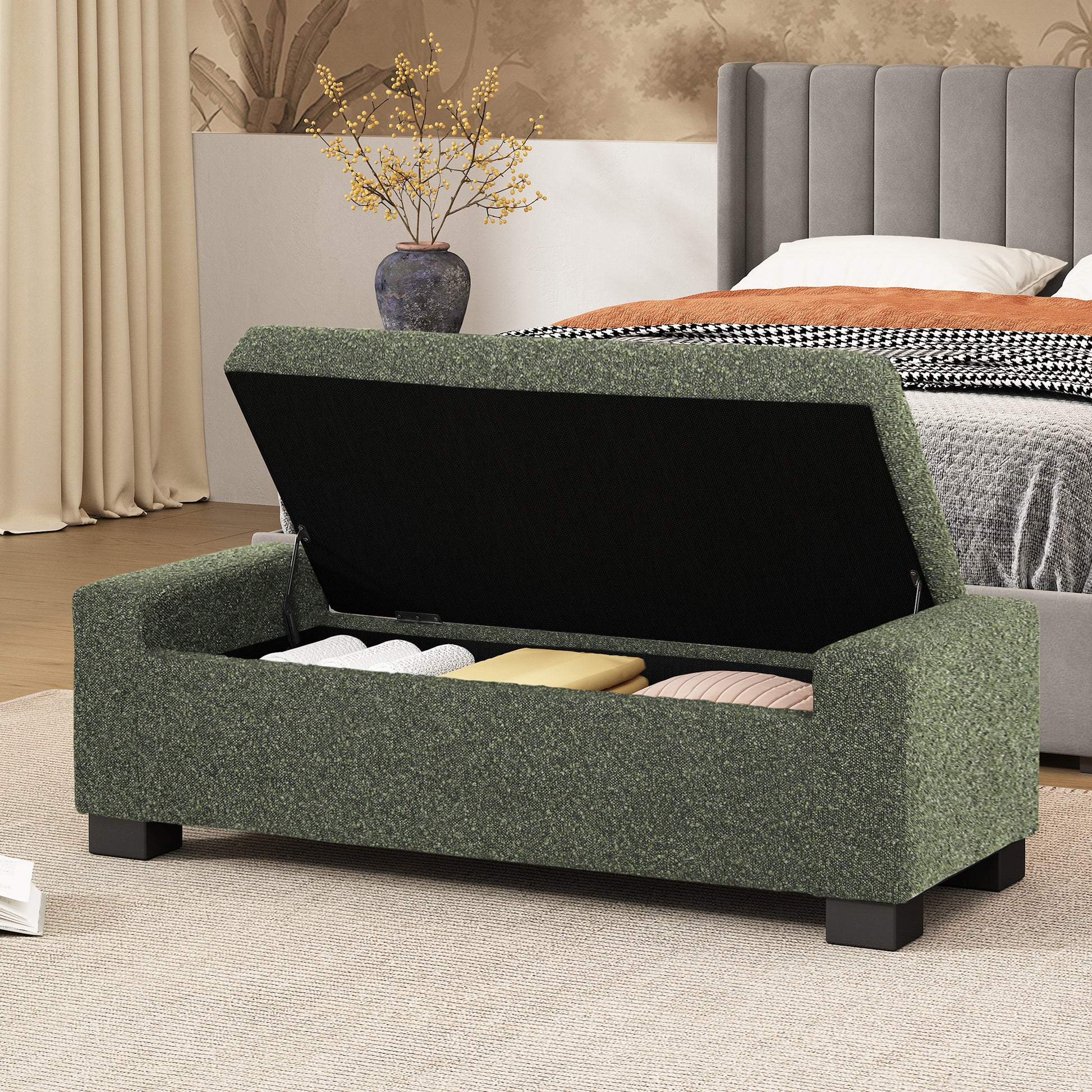 Green fabric storage ottoman bench with open lid showing interior storage space