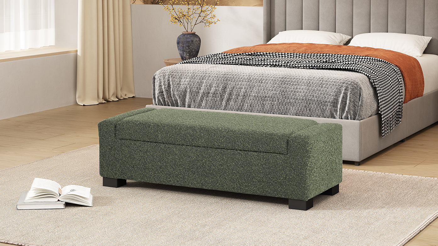 Green upholstered storage bench with hinged lid