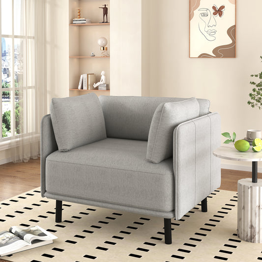 Comfortable grey armchair with plush cushions and modern black legs