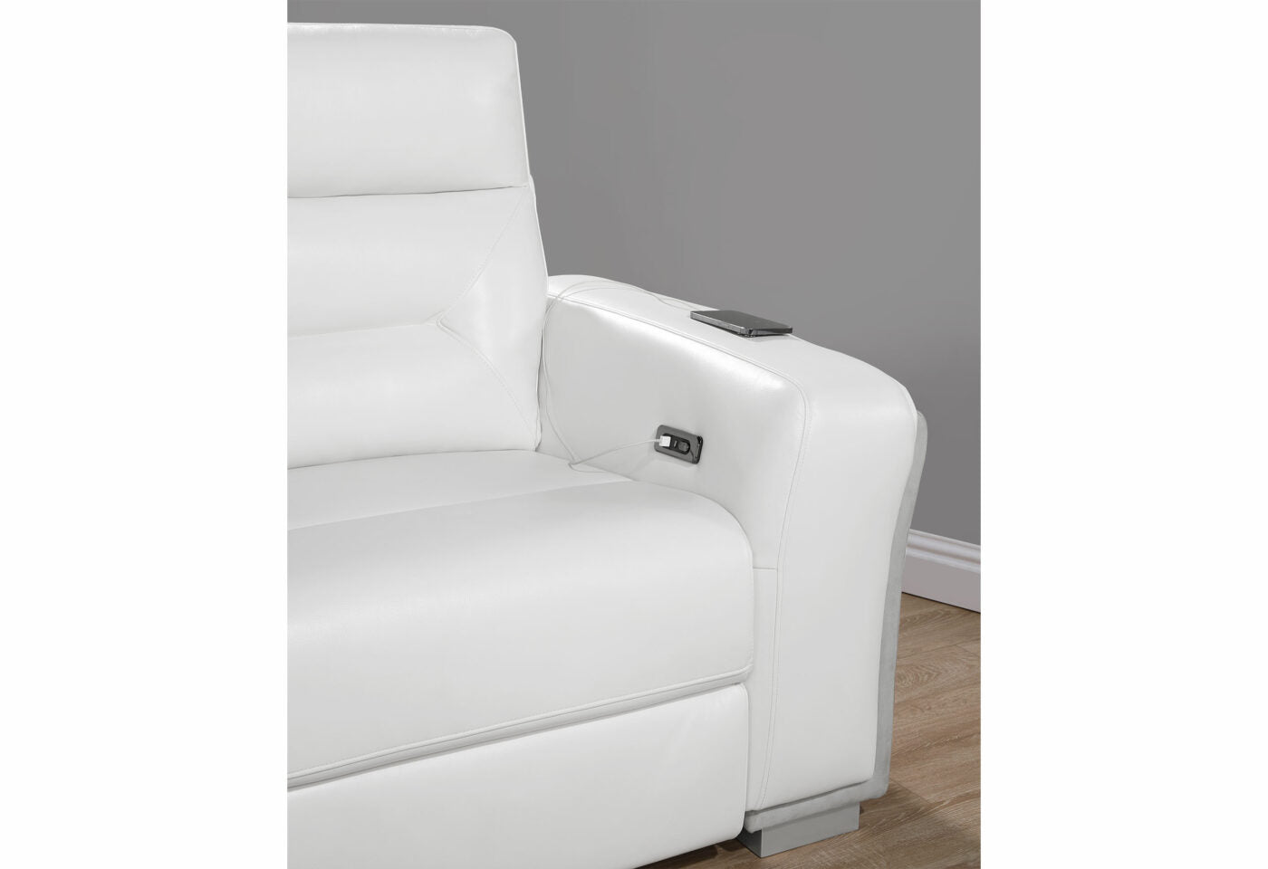 White leather recliner armrest with integrated USB port and phone charger