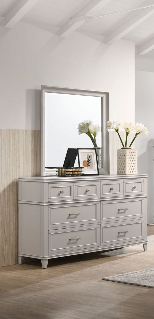 Grey wooden dresser with eight drawers and silver hardware