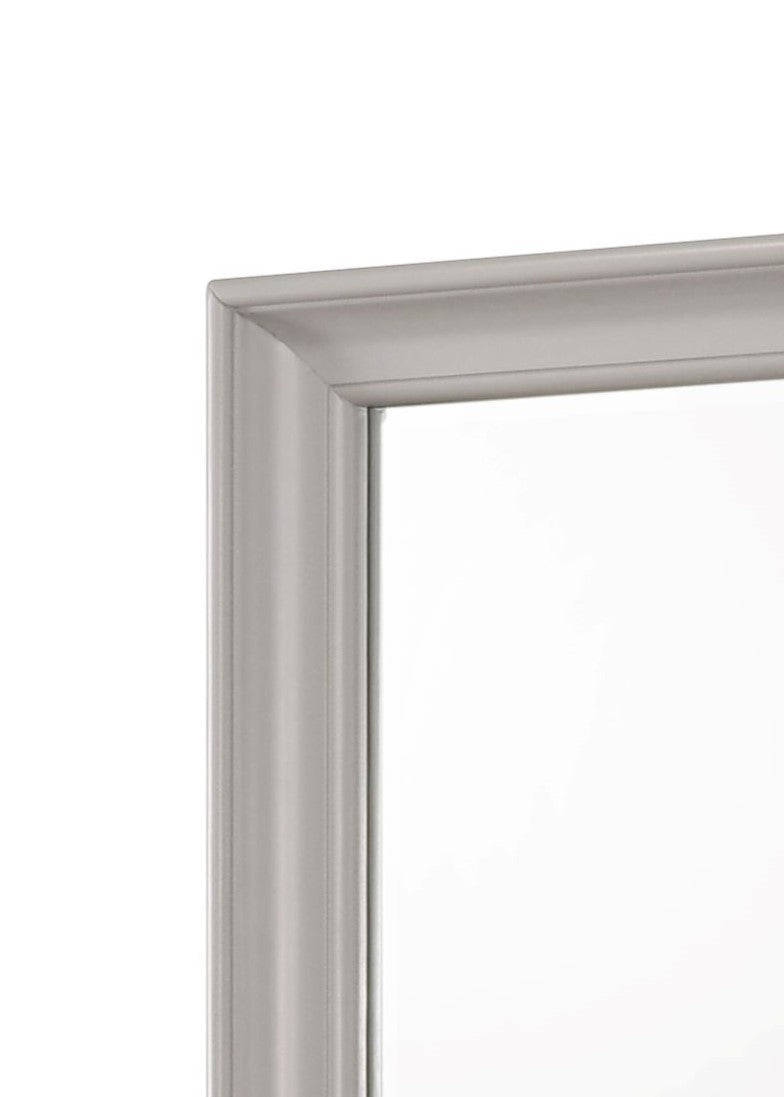 Closeup of silver ornate picture frame corner with beaded edge