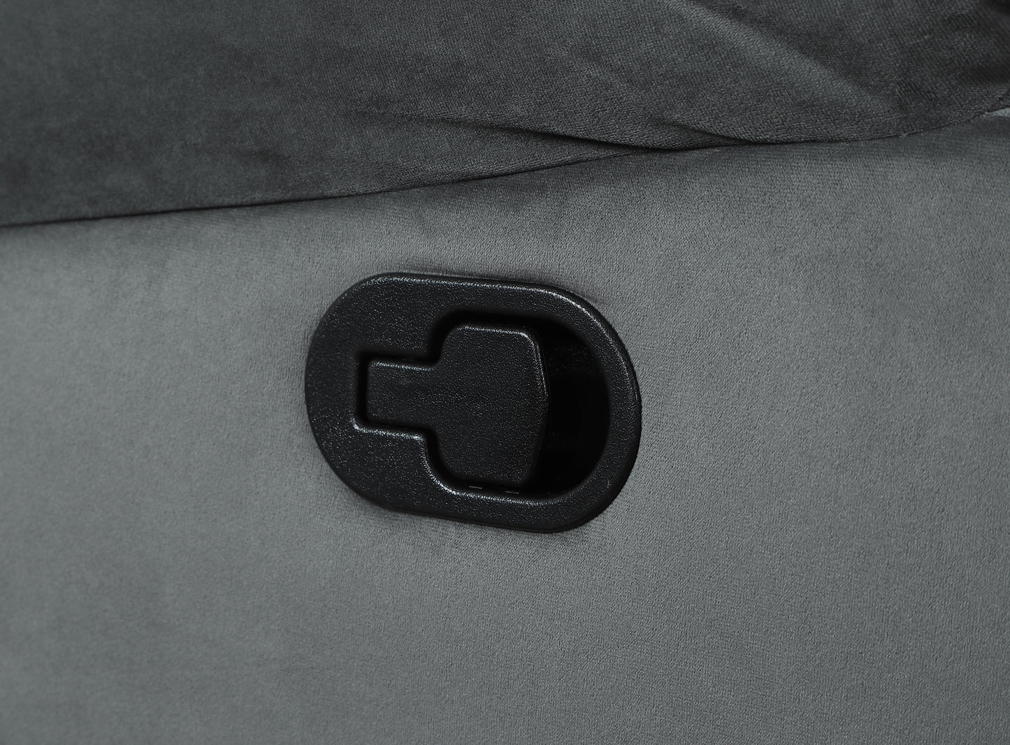 Black plastic recliner lever on grey fabric chair
