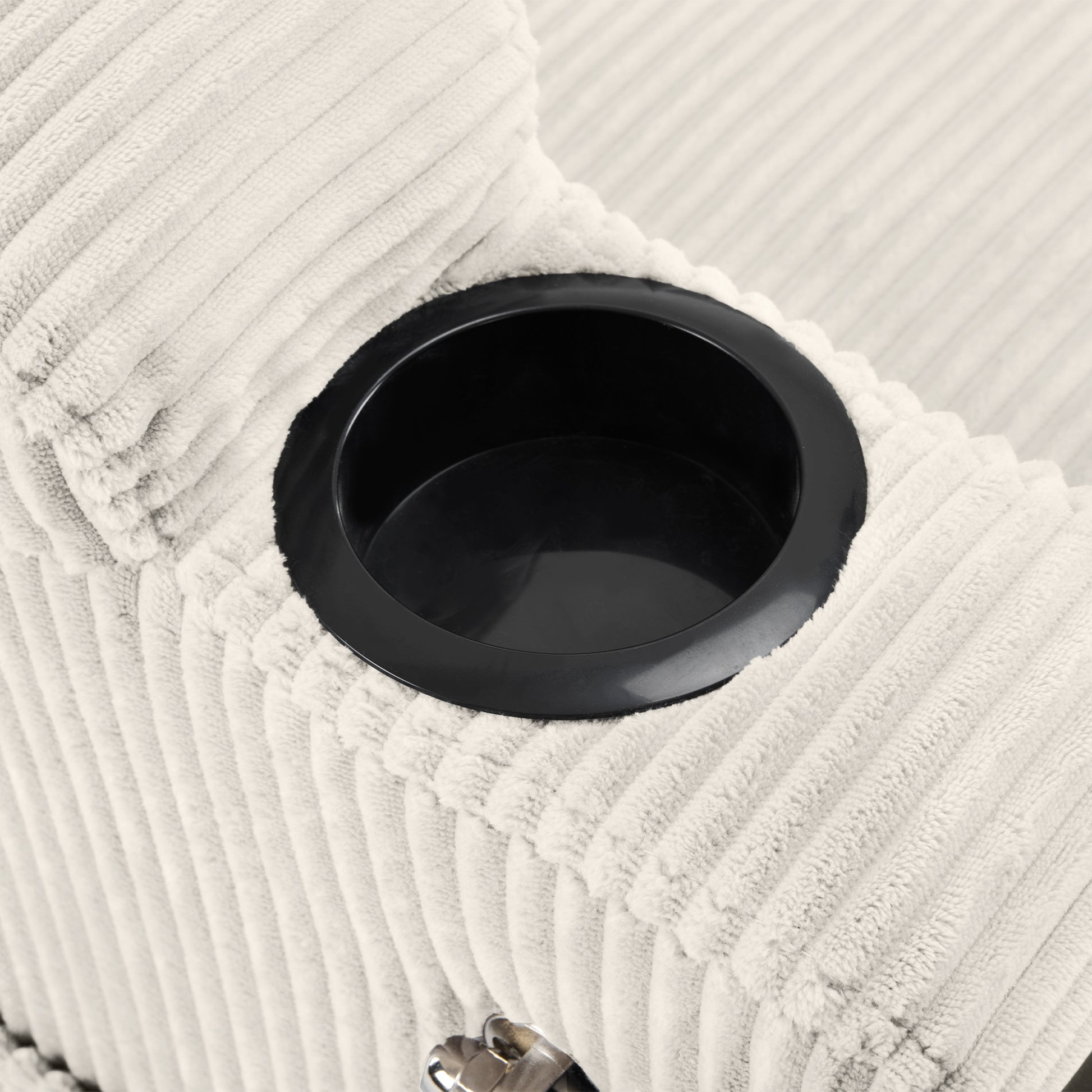 Cream corduroy armchair detail with integrated black cup holder