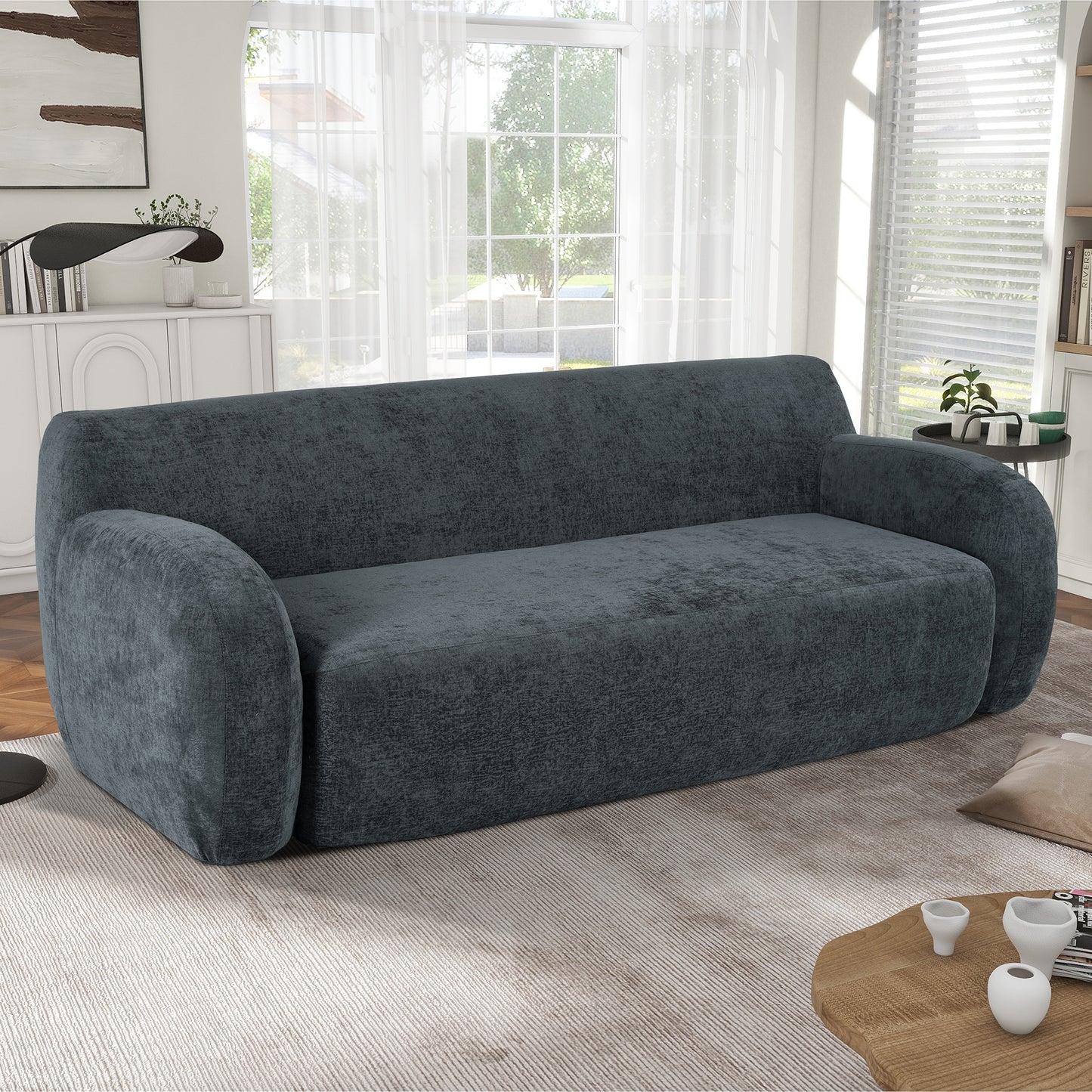 Dark gray textured fabric sofa with rounded arms and deep seat