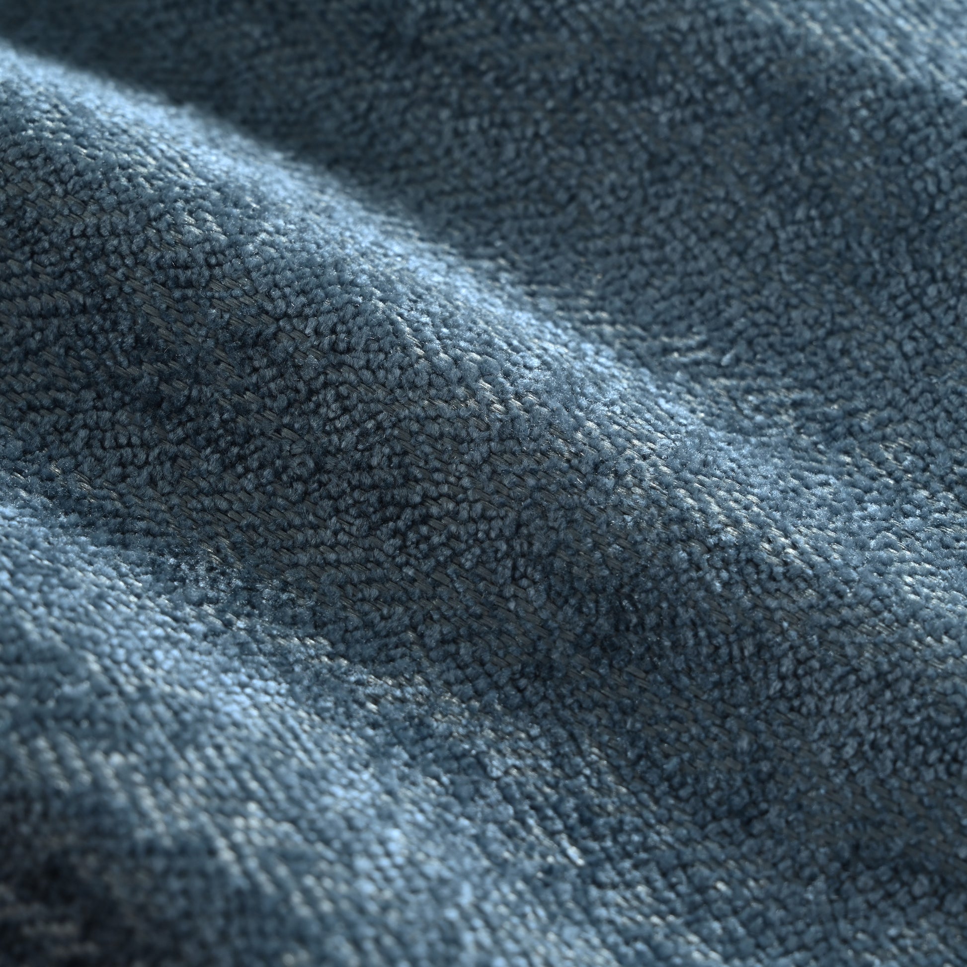 Closeup of textured navy blue velvet fabric