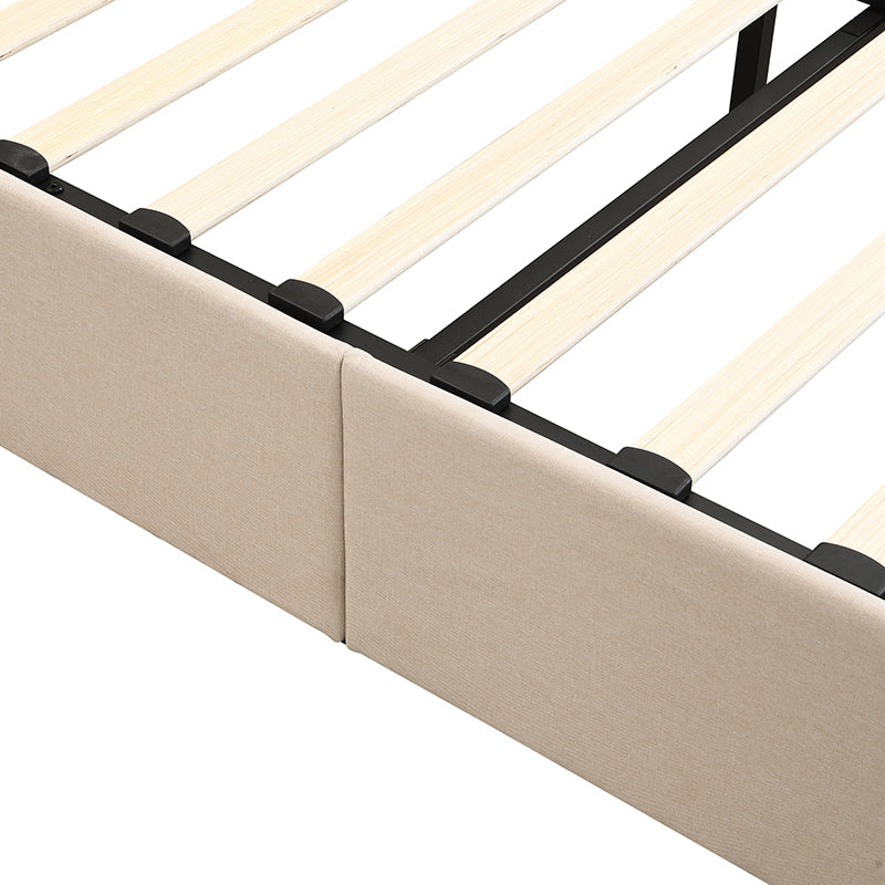 Closeup of beige upholstered bed frame edge with wooden slats