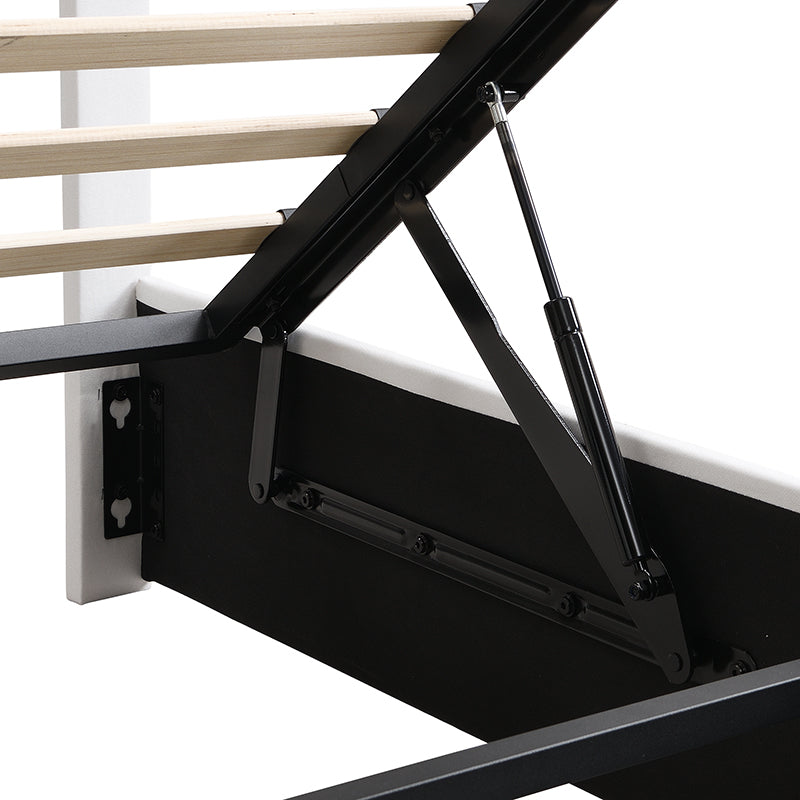 Metal gas lift mechanism on a white and black ottoman bed frame