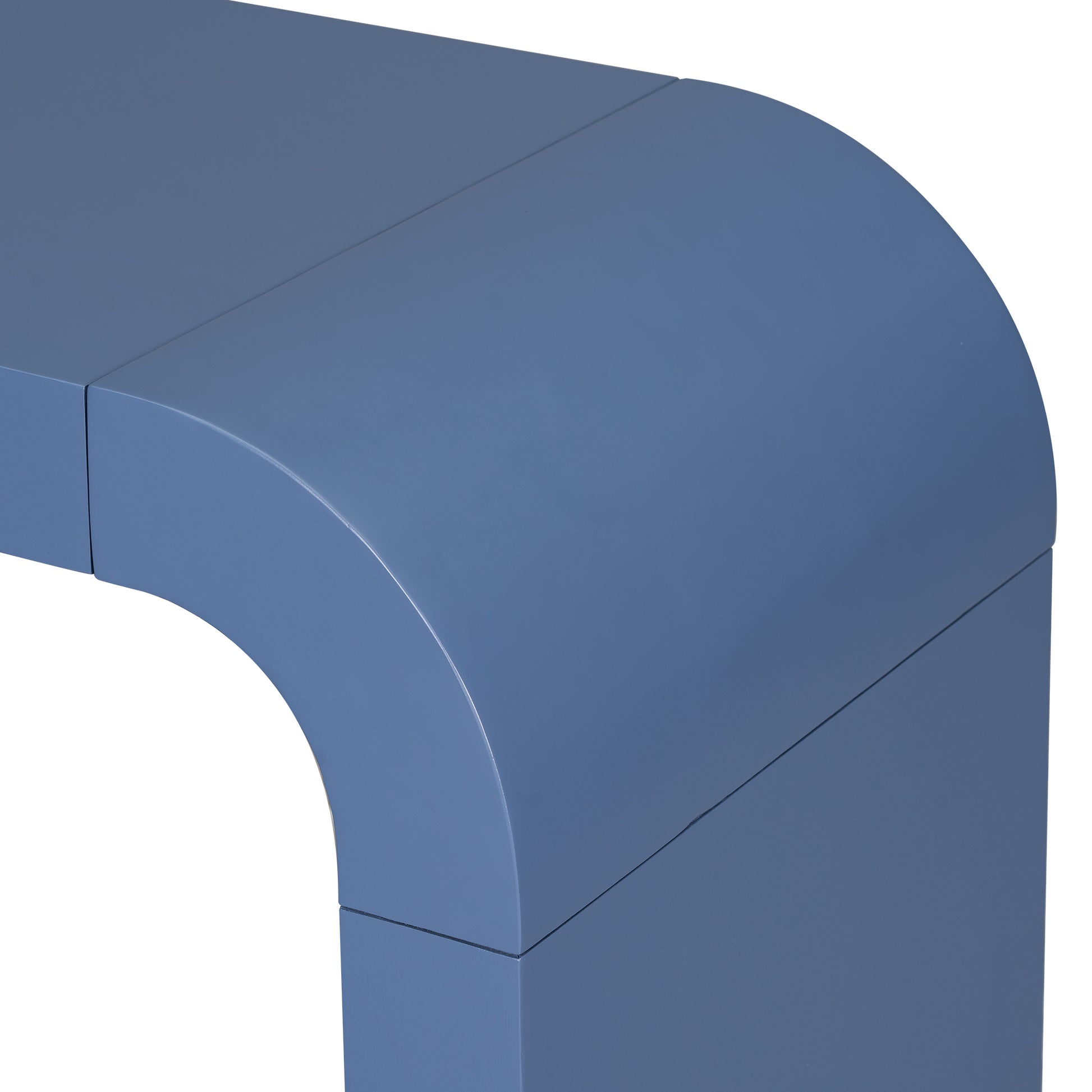 Closeup of a curved blue entryway table leg with a smooth finish