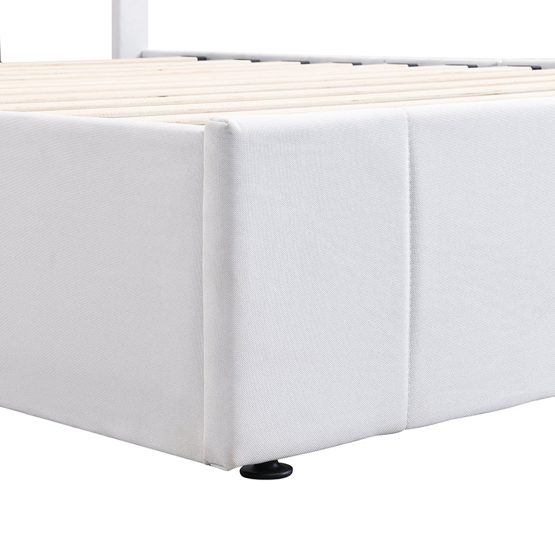 White upholstered bed frame corner detail with wooden slats