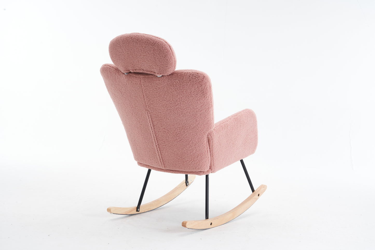 Pink teddy fabric rocking chair with black metal legs and wooden rockers