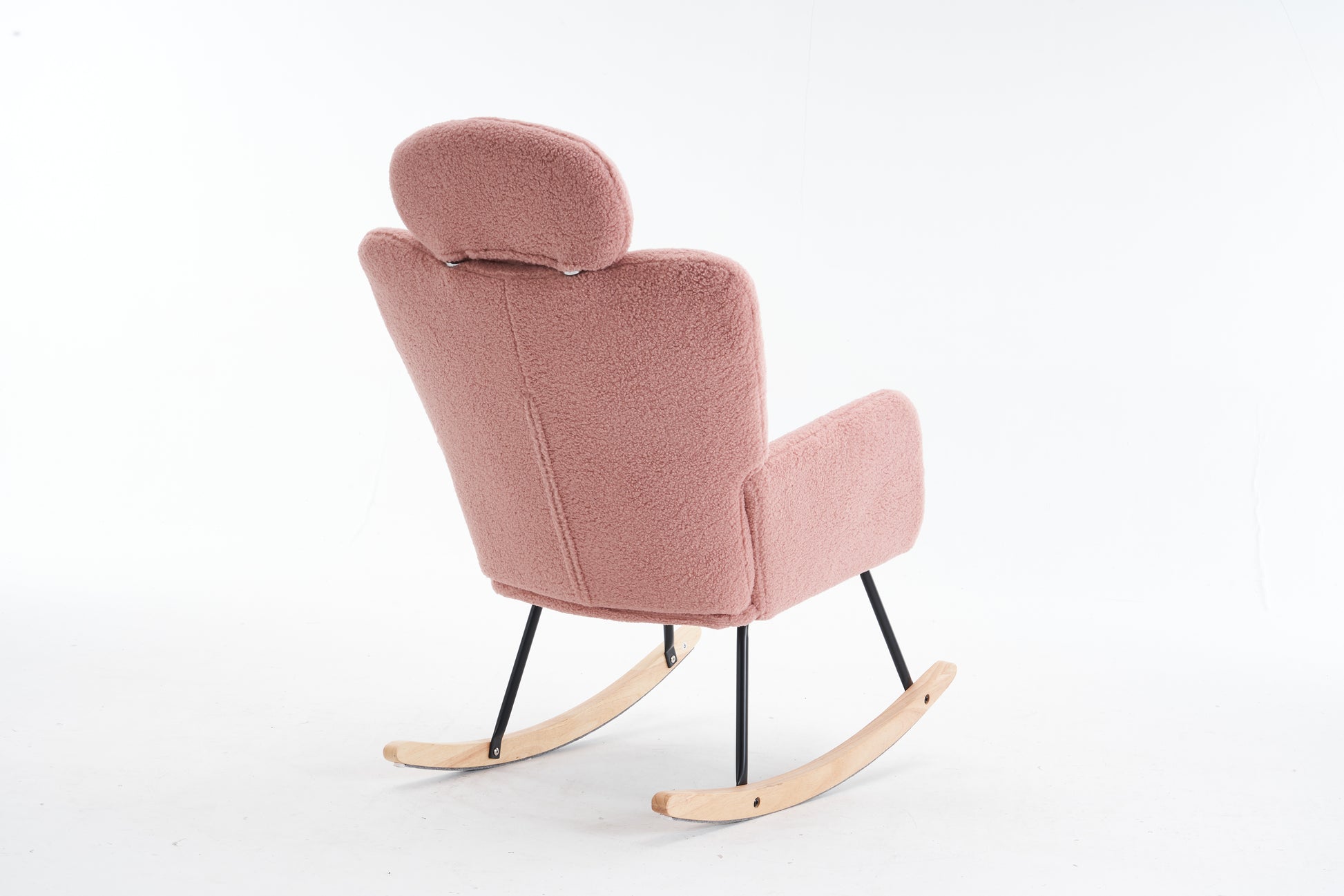 Pink teddy fabric rocking chair with black metal legs and wooden rockers
