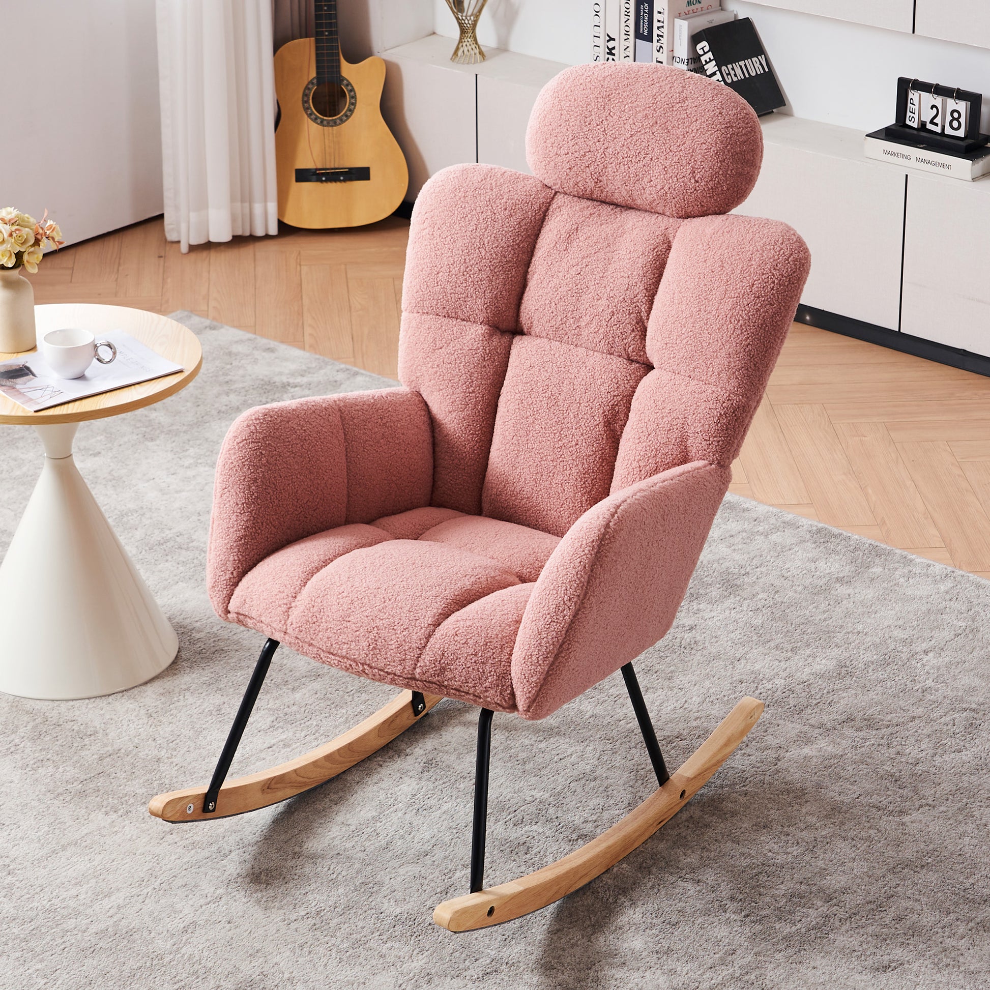 Pink boucle rocking chair with plush headrest and wooden rockers
