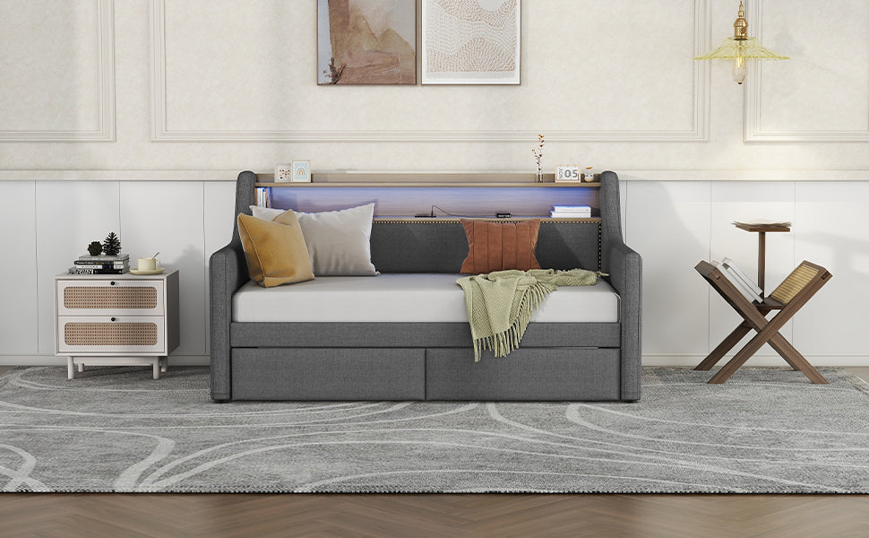 Dark gray upholstered sofa bed with builtin shelf and LED lights