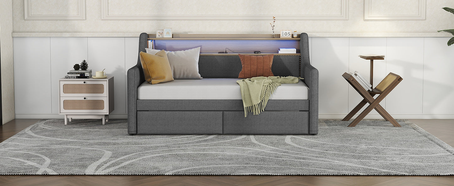 Dark grey upholstered daybed with integrated shelf and USB ports