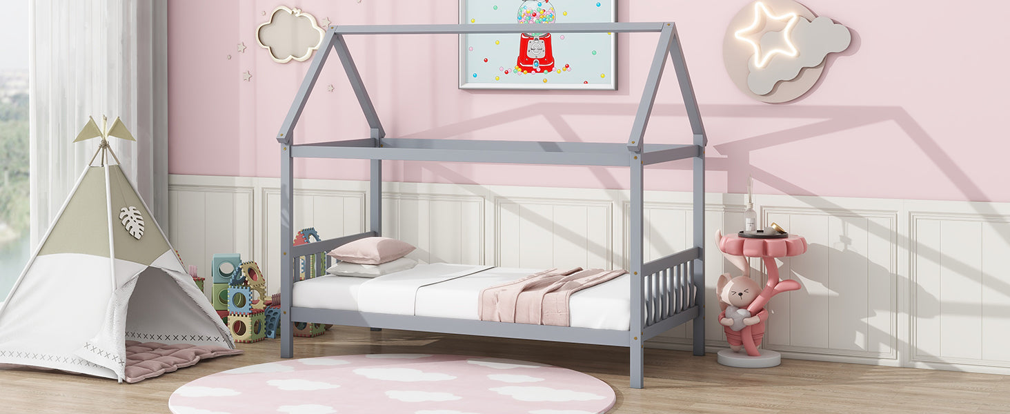 Gray wooden house bed frame with white linens and pink throw