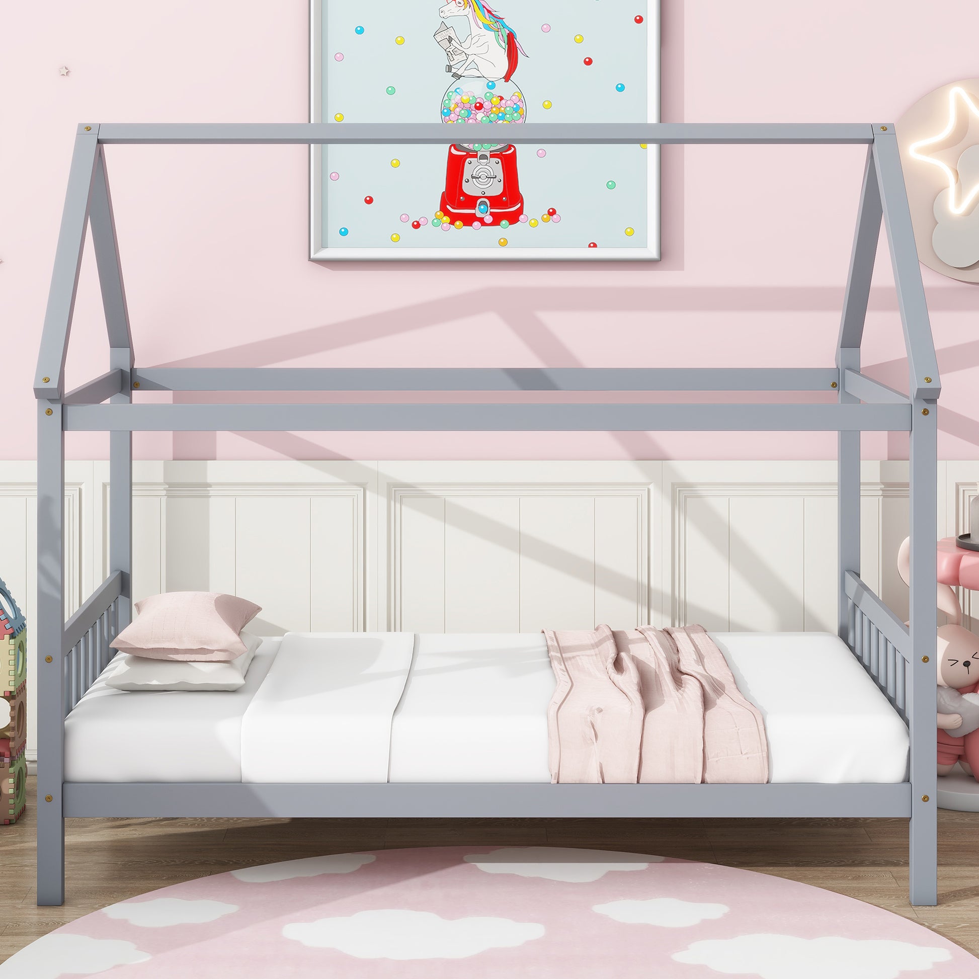 Gray wooden house bed frame with white bedding and pink throw