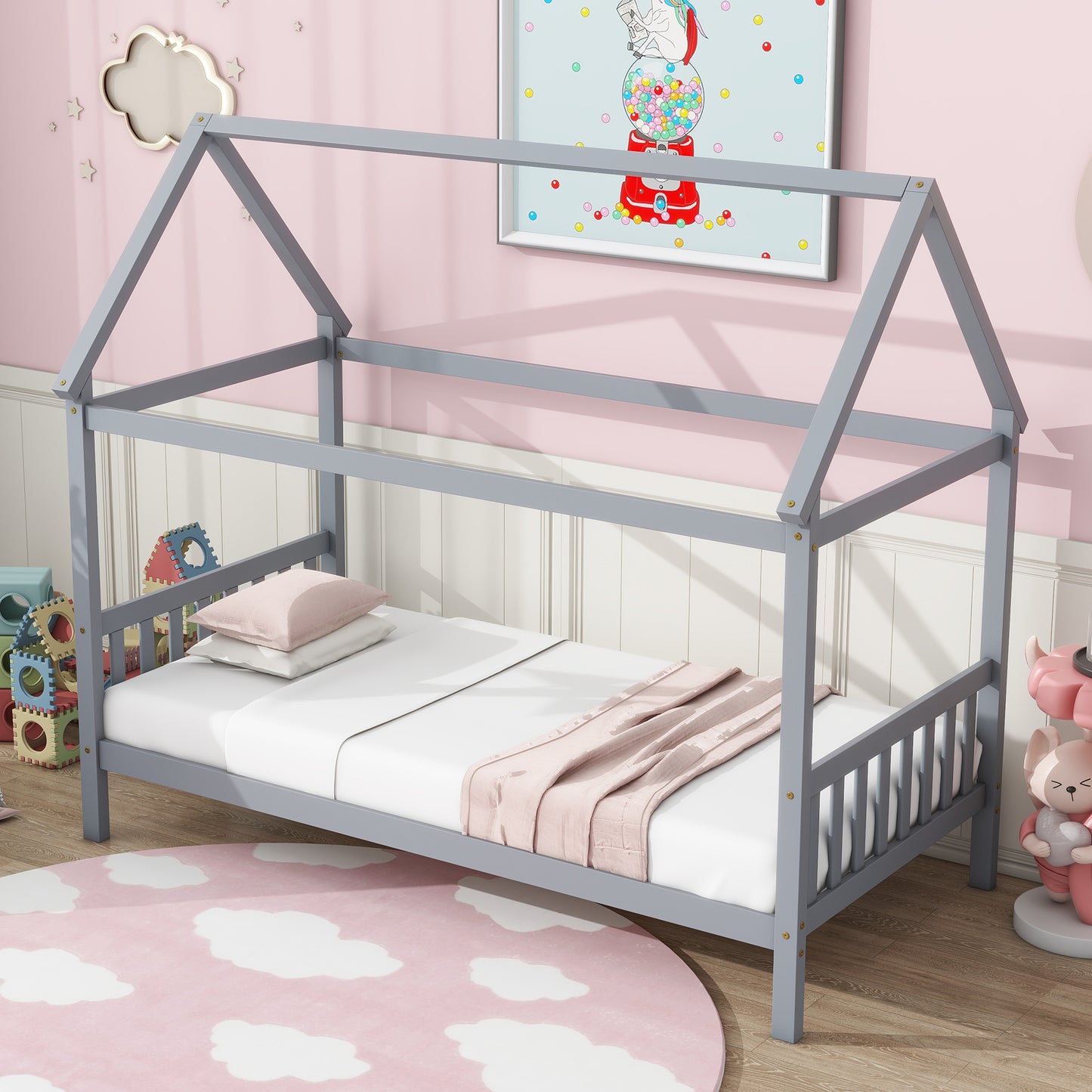 Gray wooden house bed frame with white bedding and pink throw