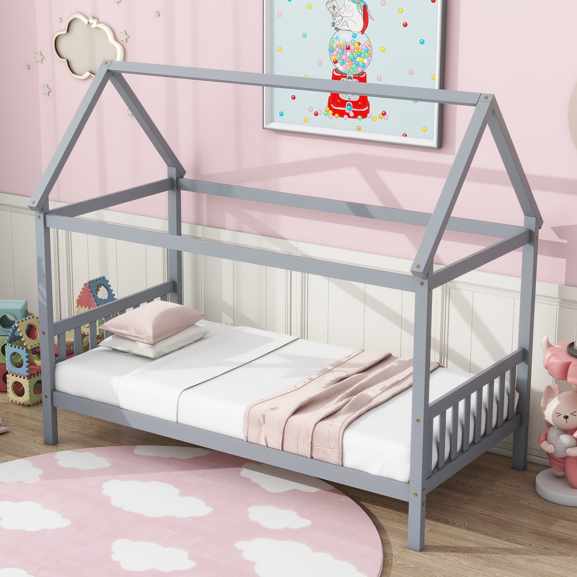Gray wooden house bed frame with white bedding and pink throw
