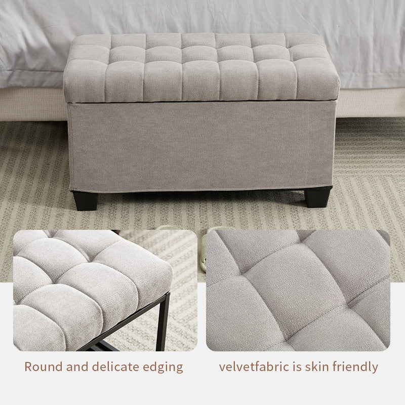 Tufted grey storage ottoman with skirted base