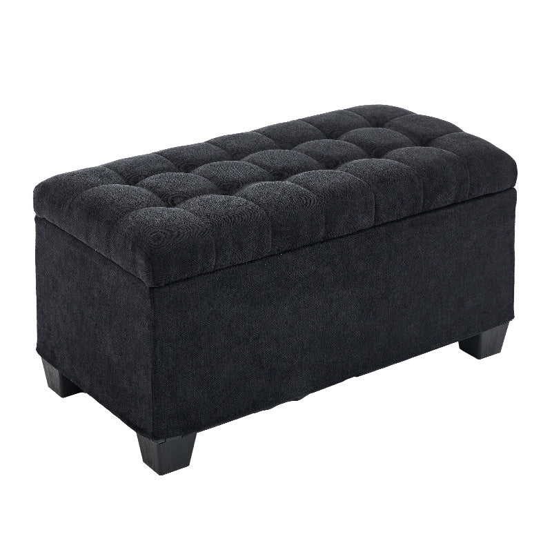 Dark gray tufted storage ottoman with wooden legs