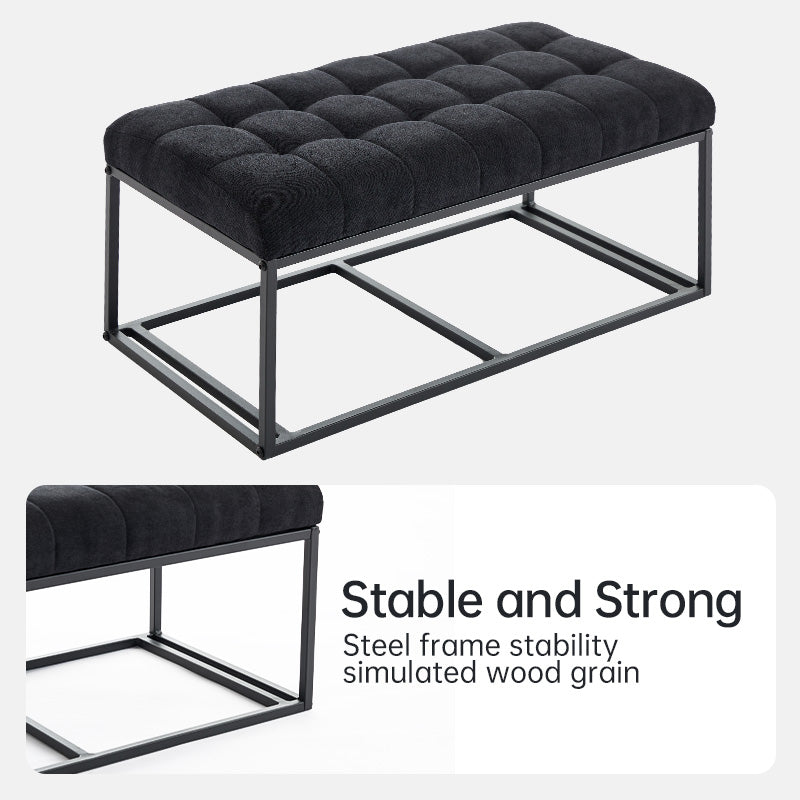 Black tufted ottoman with black metal frame