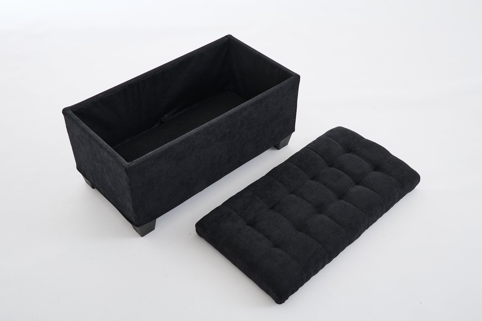 Black velvet storage ottoman with tufted lid