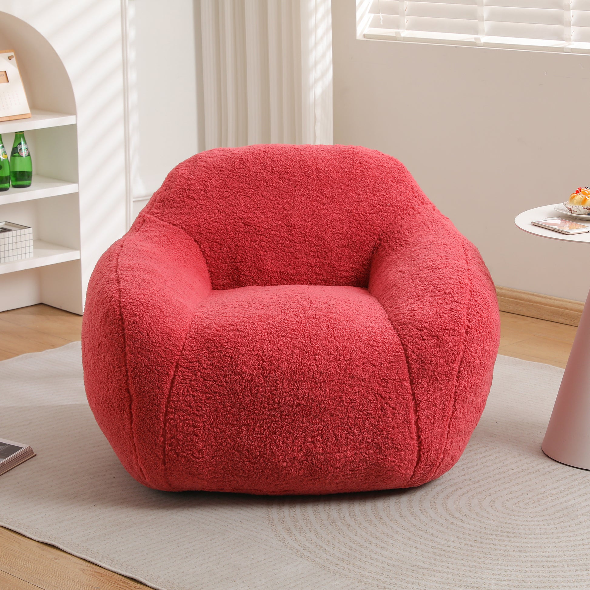 Plush red bean bag chair with comfortable textured fabric for cozy lounging