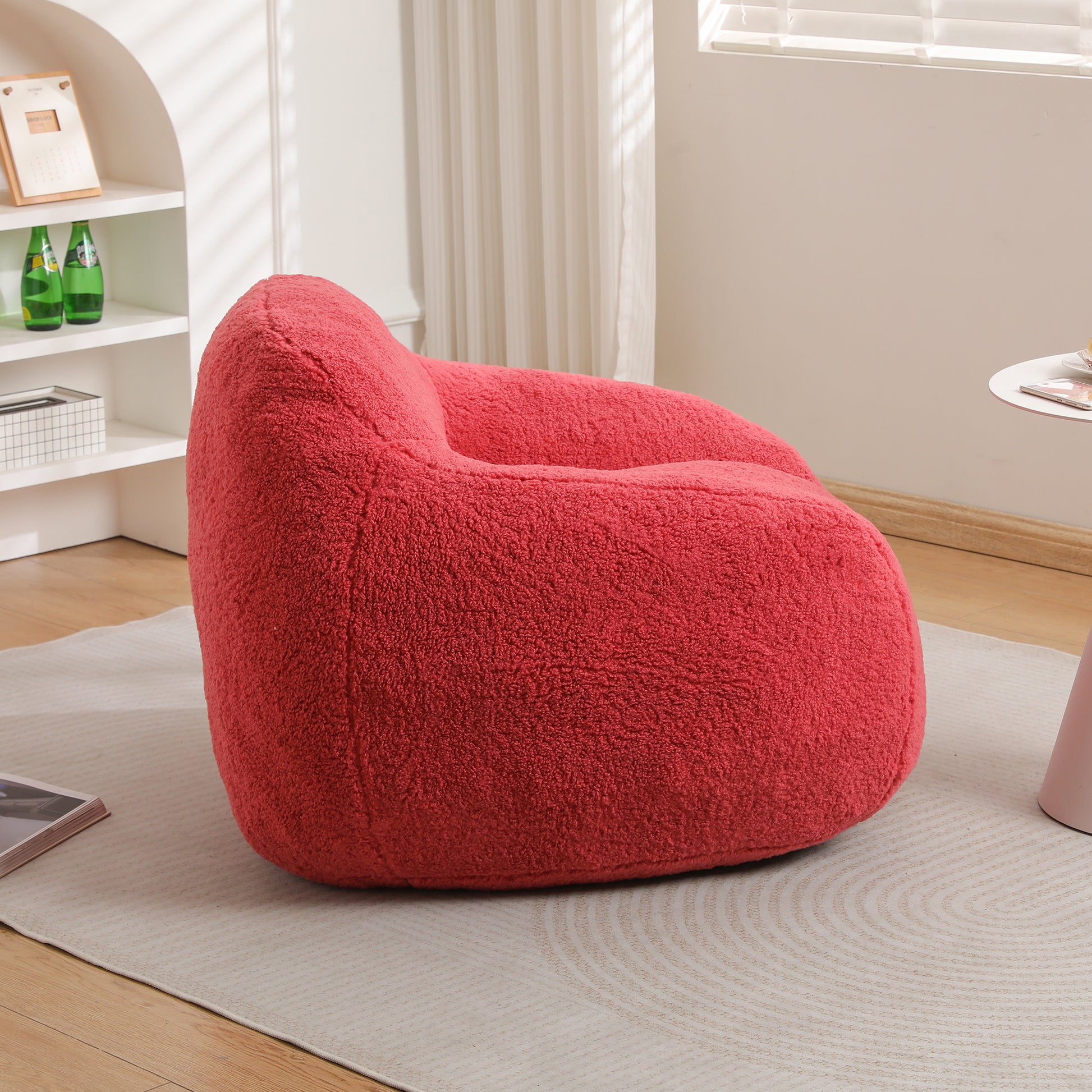 Plush coral accent chair with rounded design