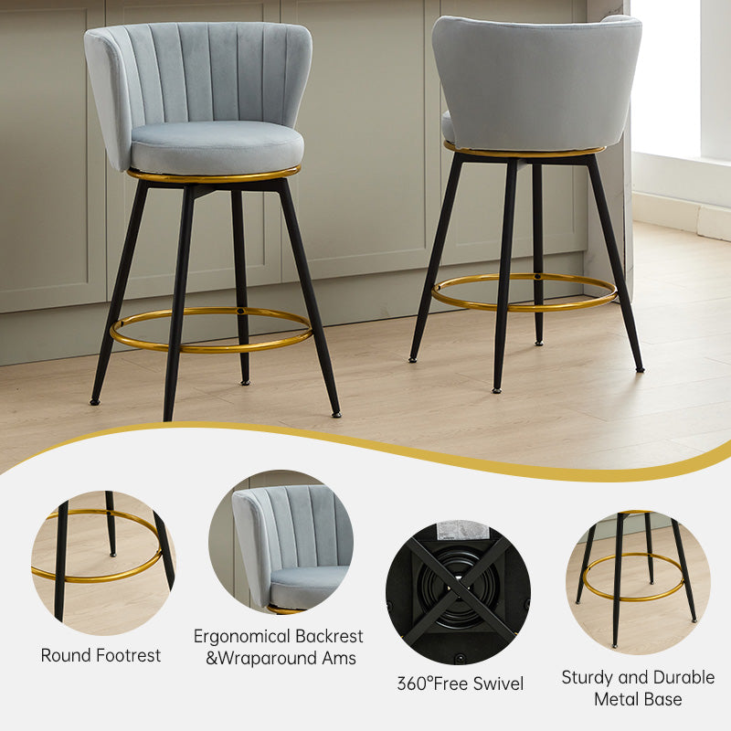 Light gray velvet bar stool with gold footrest and black legs