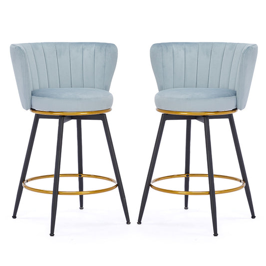 Light blue velvet bar stools with gold accent rings and black legs