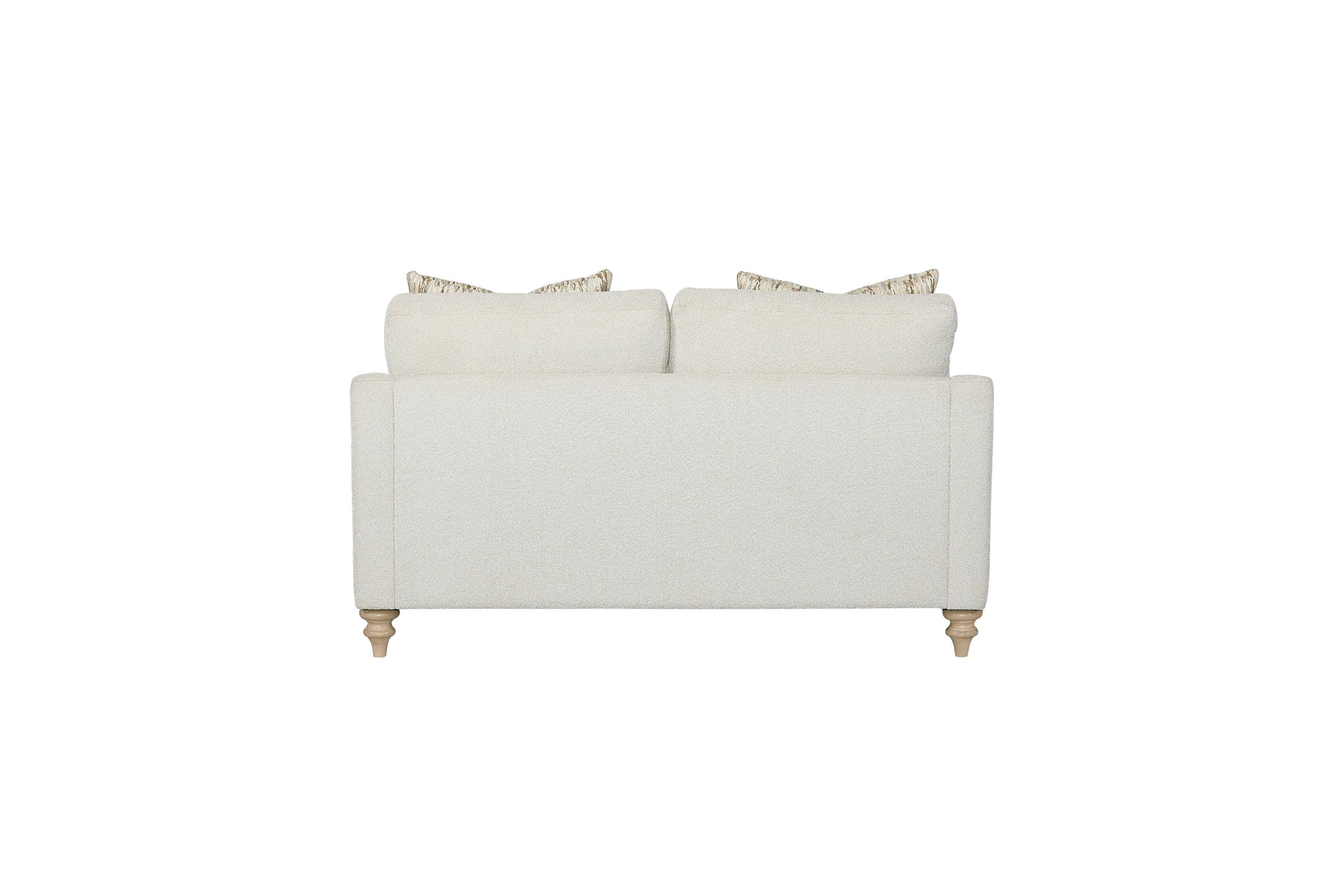 Back view of a creamcolored textured fabric sofa with decorative lumbar pillows and turned wooden legs