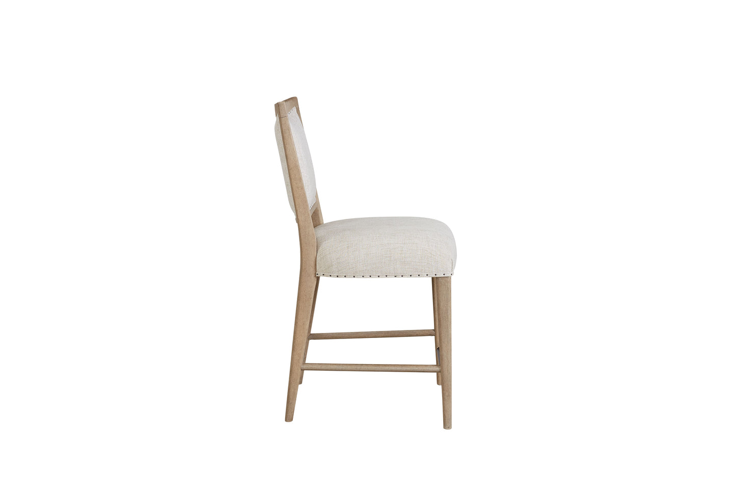 Neutral linen dining chair with light wood frame and silver nailhead trim