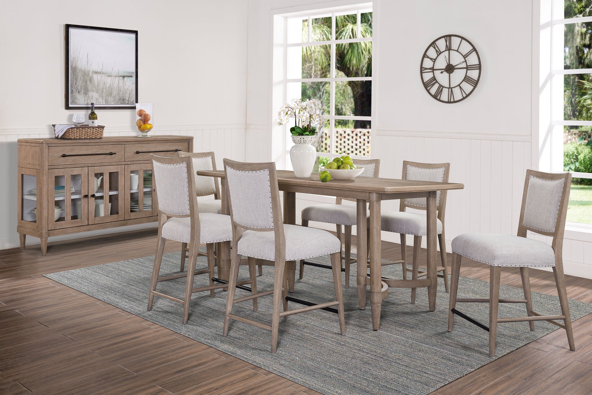 Rustic wood dining table set with six upholstered chairs and a sideboard