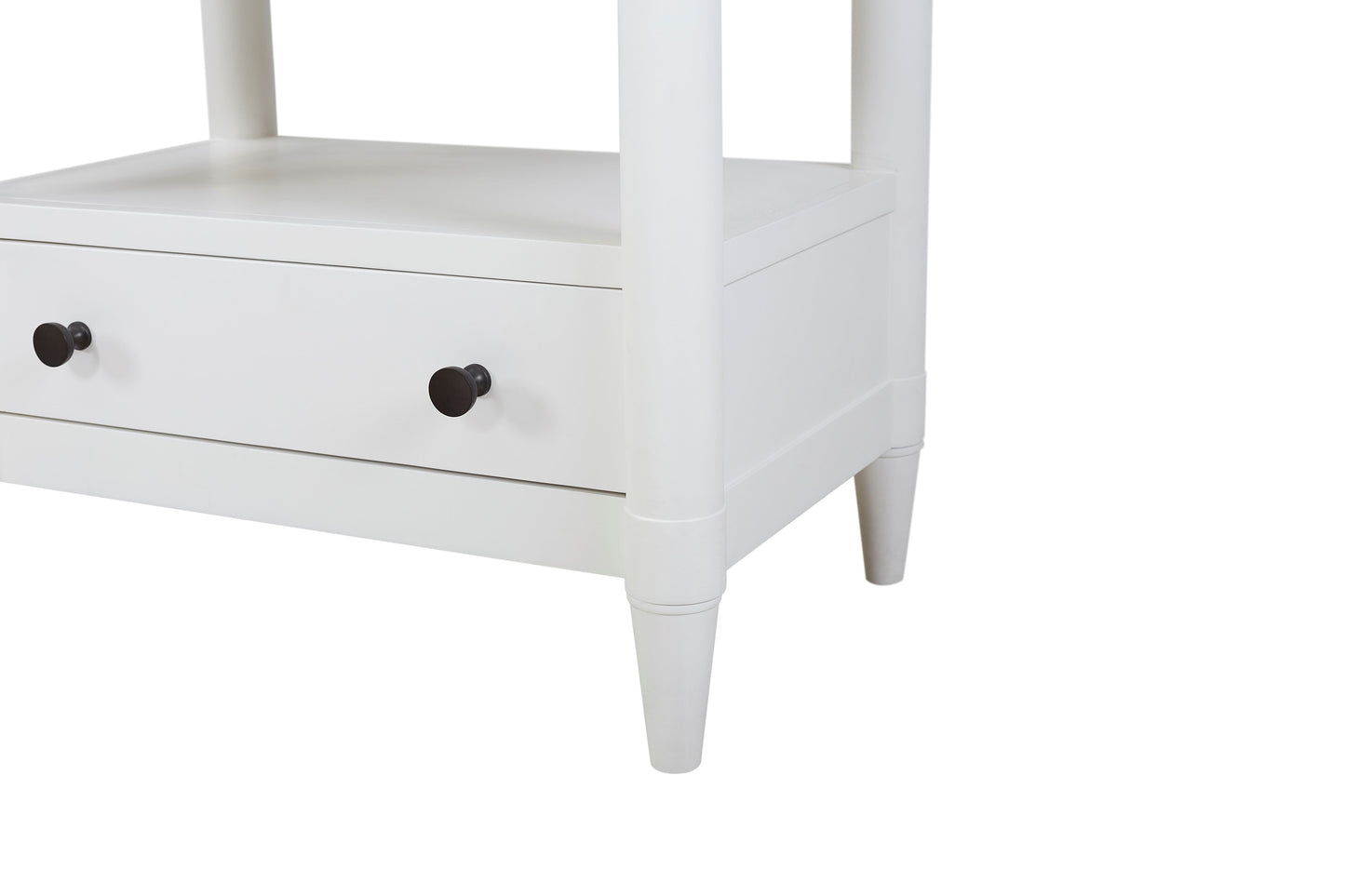 White twodrawer side table with black round knobs