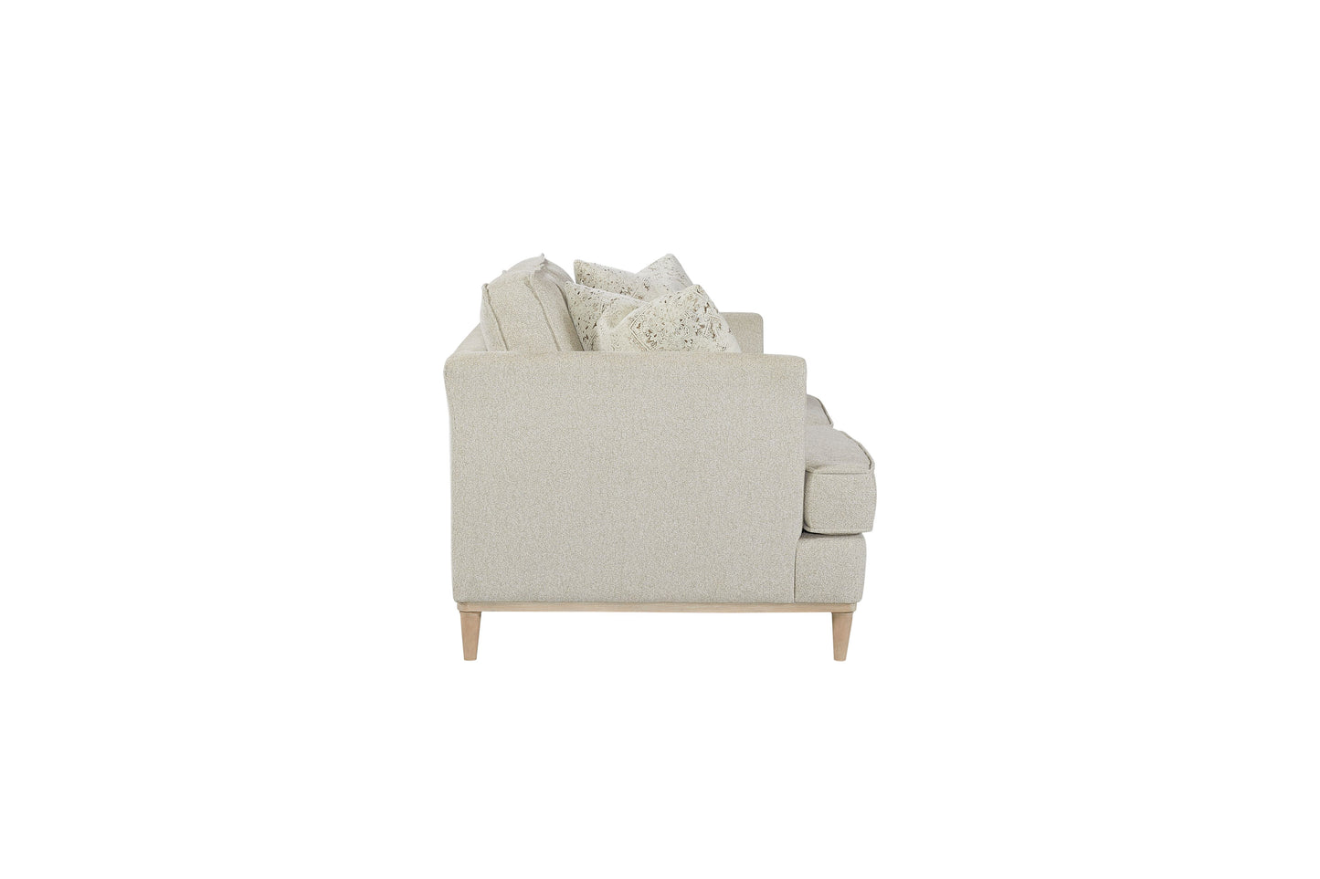 Light beige textured fabric sofa with patterned throw pillows
