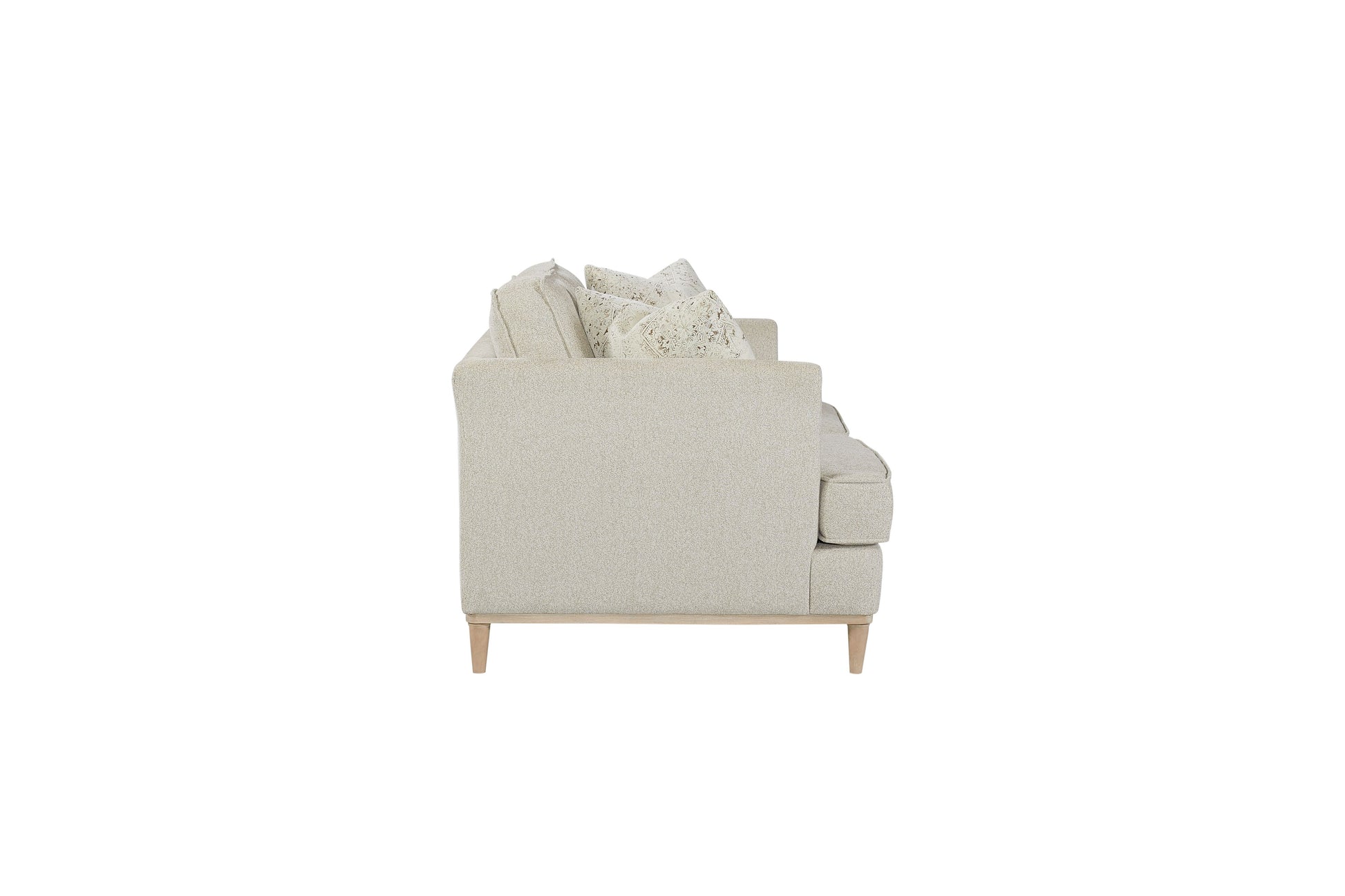 Light beige textured fabric sofa with patterned throw pillows