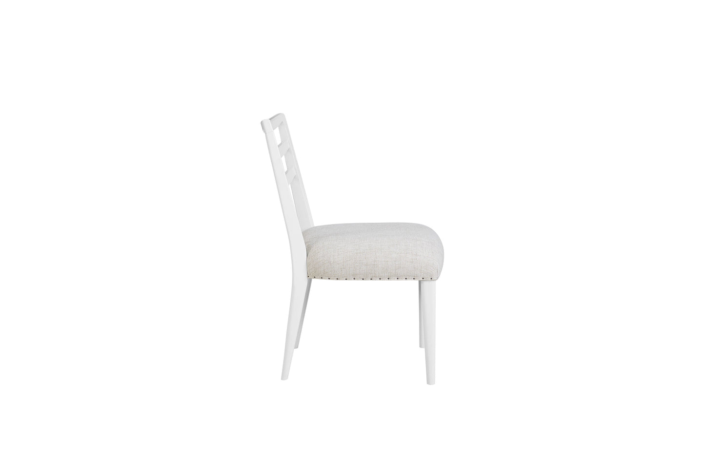 White upholstered dining chair with decorative nailhead trim and a unique open back design