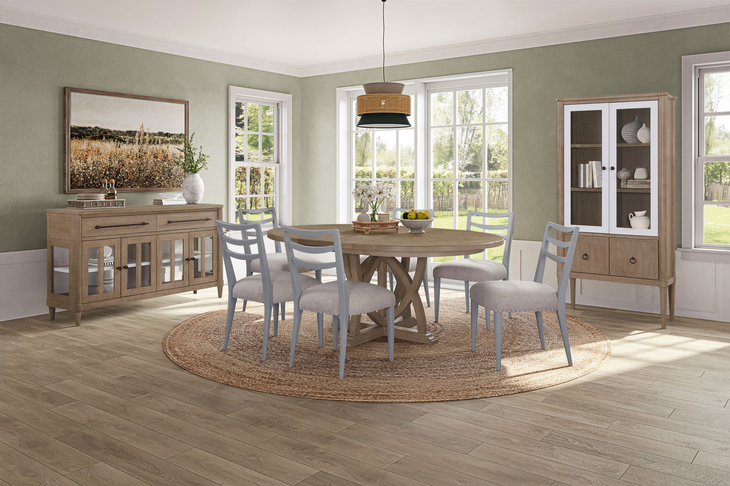 Round oak dining table with distressed wood pedestal base and six grey upholstered chairs