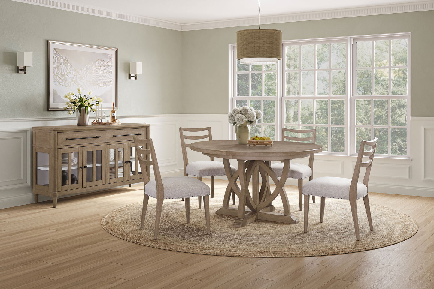 Round pedestal dining table with rustic wood finish and upholstered chairs