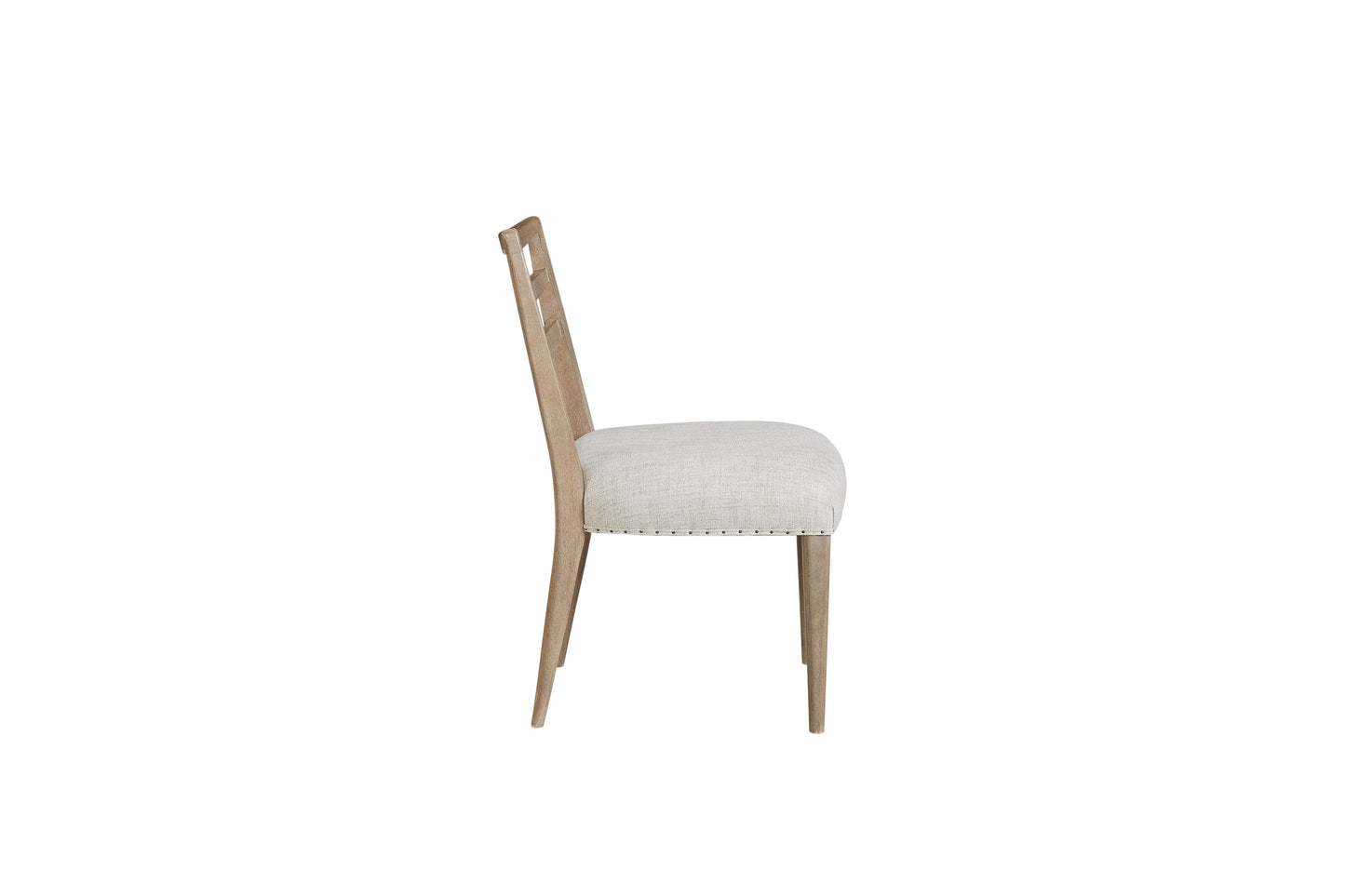 Side view of a light wood dining chair with a textured cream upholstered seat and back