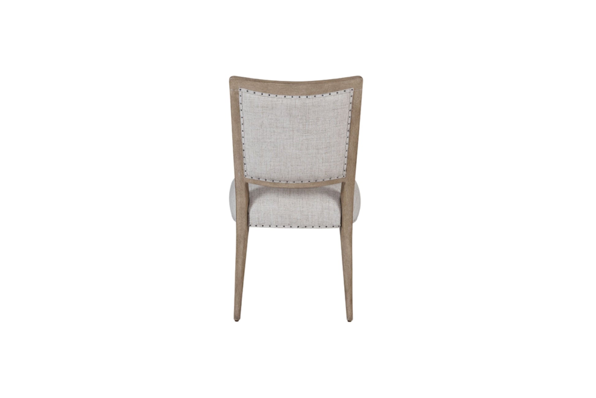 Neutral upholstered dining chair with nailhead trim and wooden frame