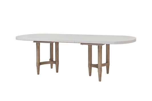 White oval dining table with light wood legs
