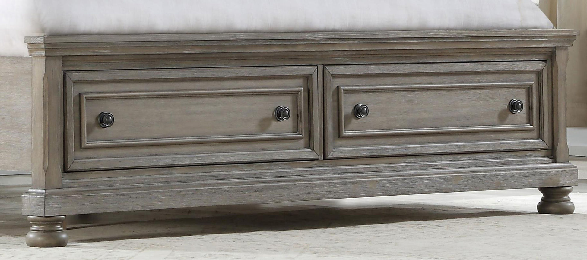 Gray distressed wood dresser with two drawers and dark round knobs