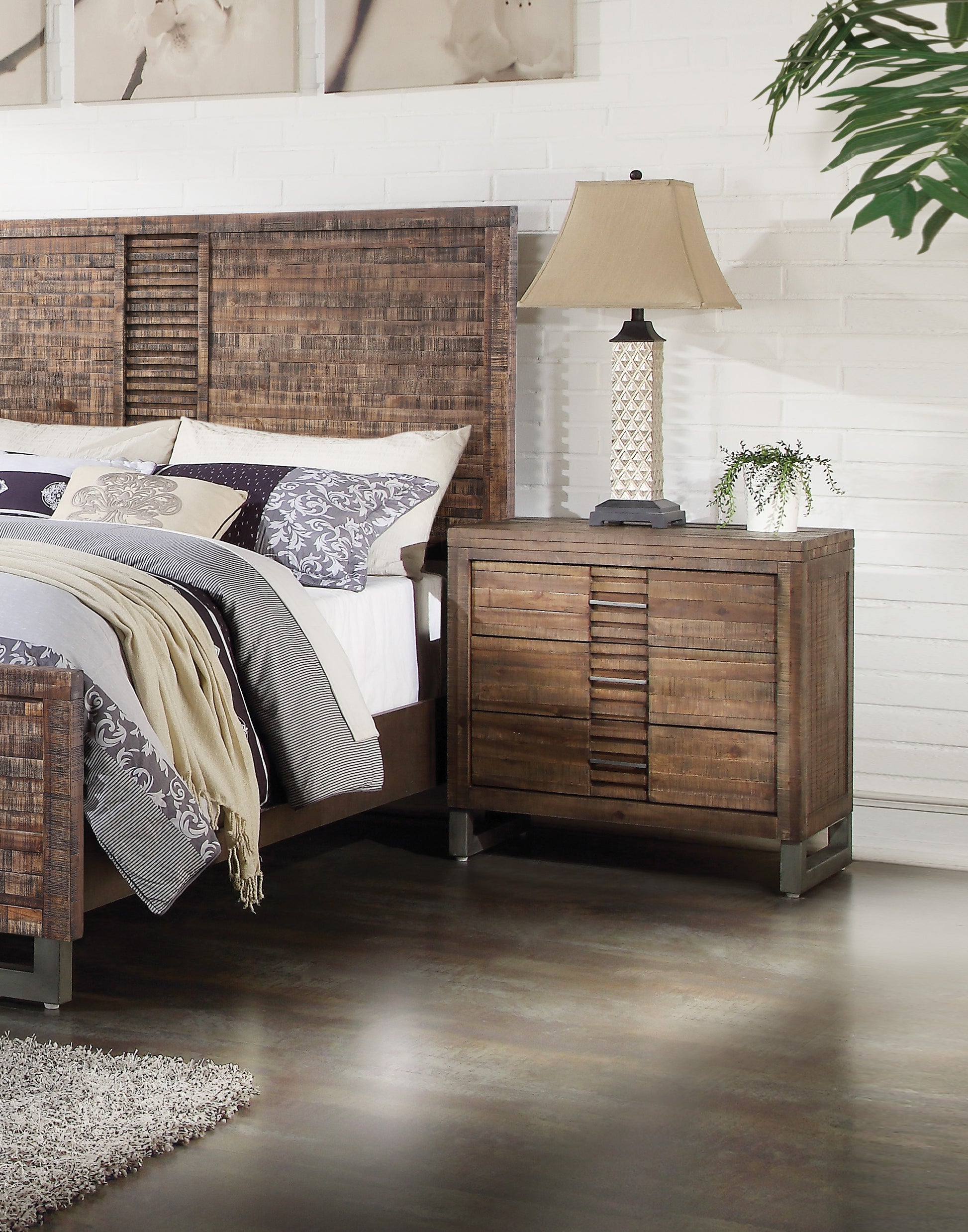 Rustic wood nightstand with three drawers and metal accents