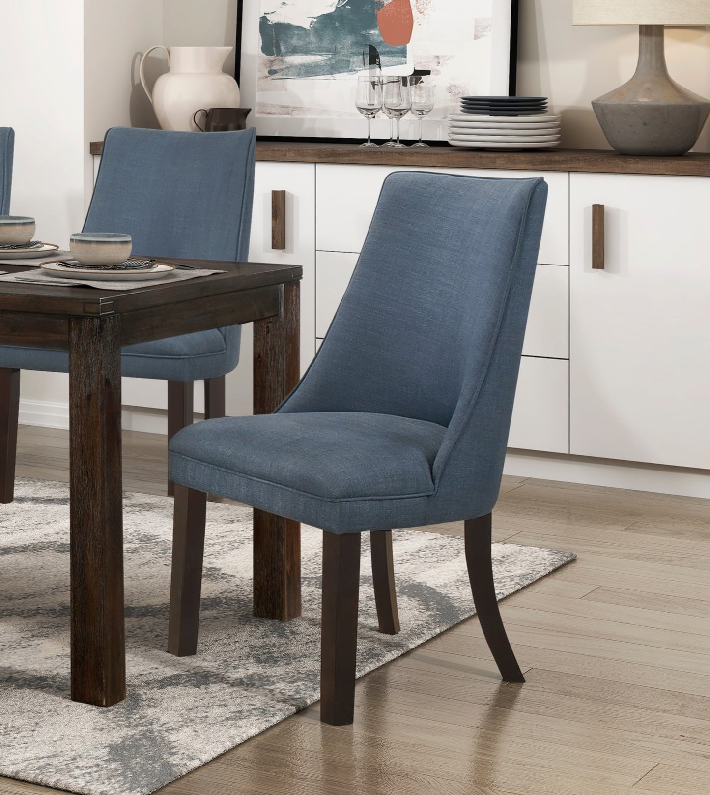 Blue upholstered dining chair with dark wood legs