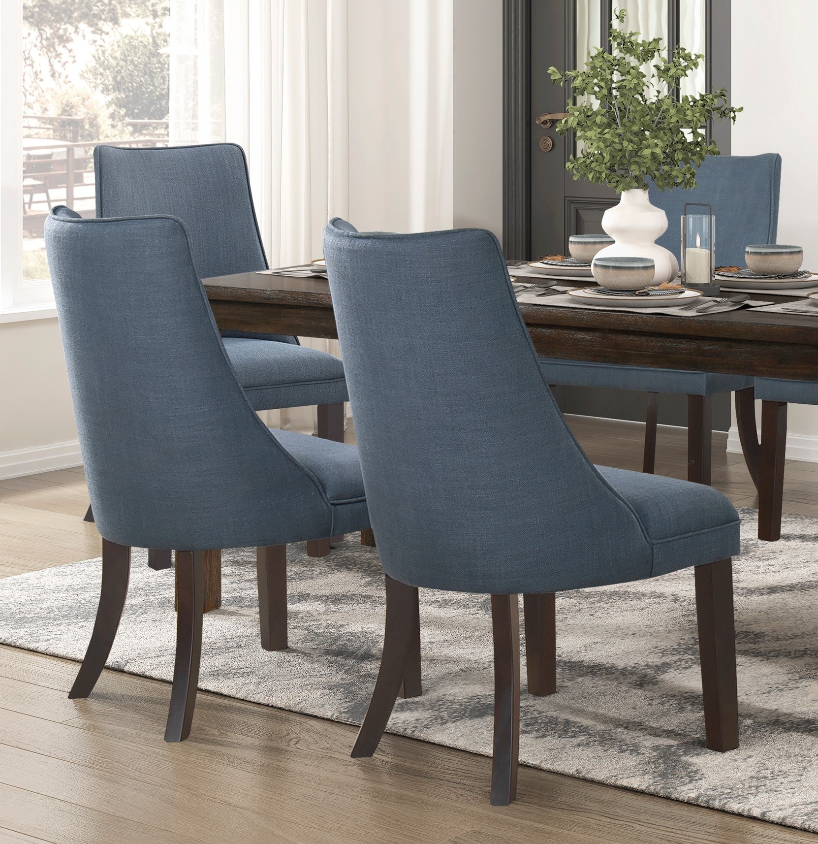 Set of  blue upholstered dining chairs with dark wood legs modern style