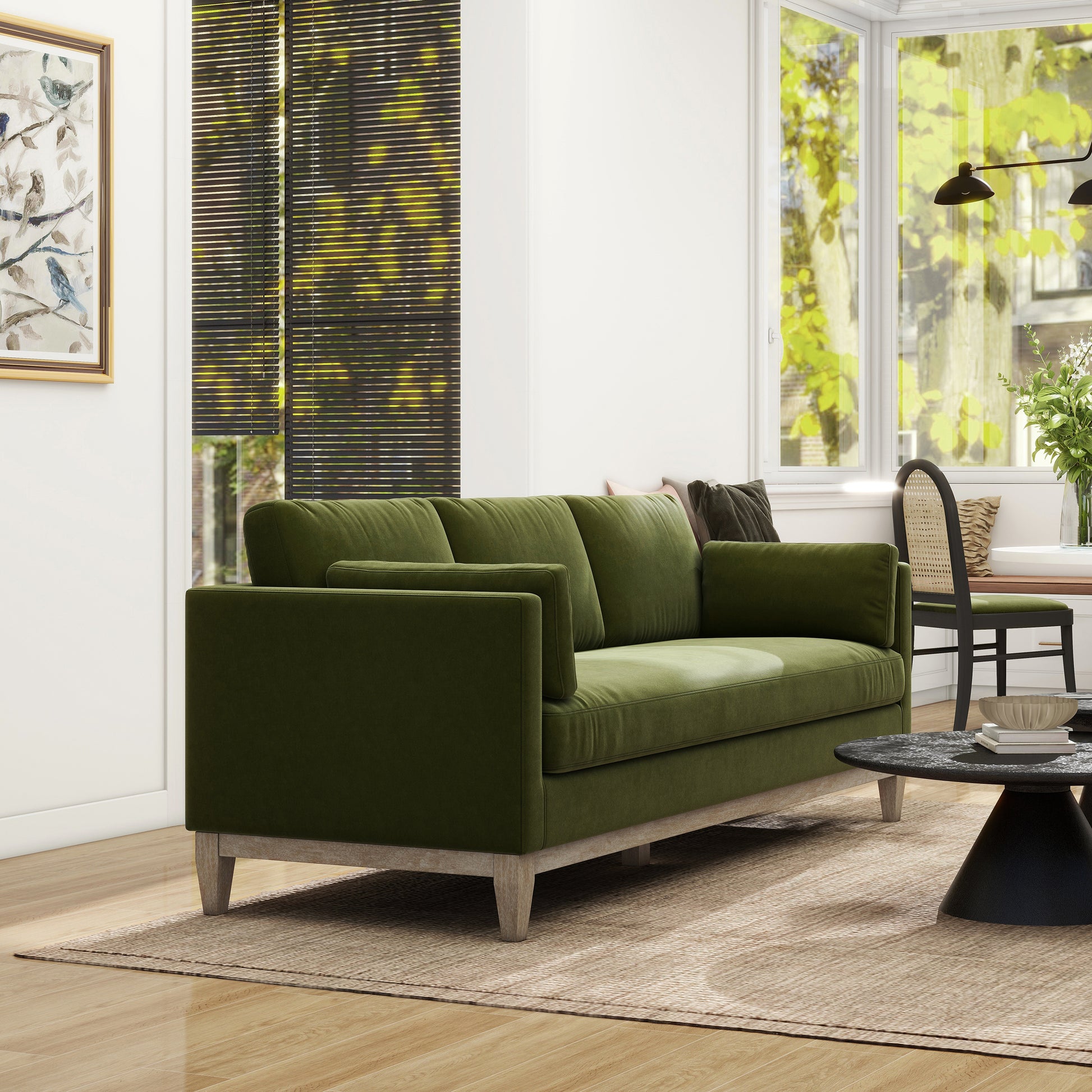 Modern green velvet sofa with clean lines and light wood legs