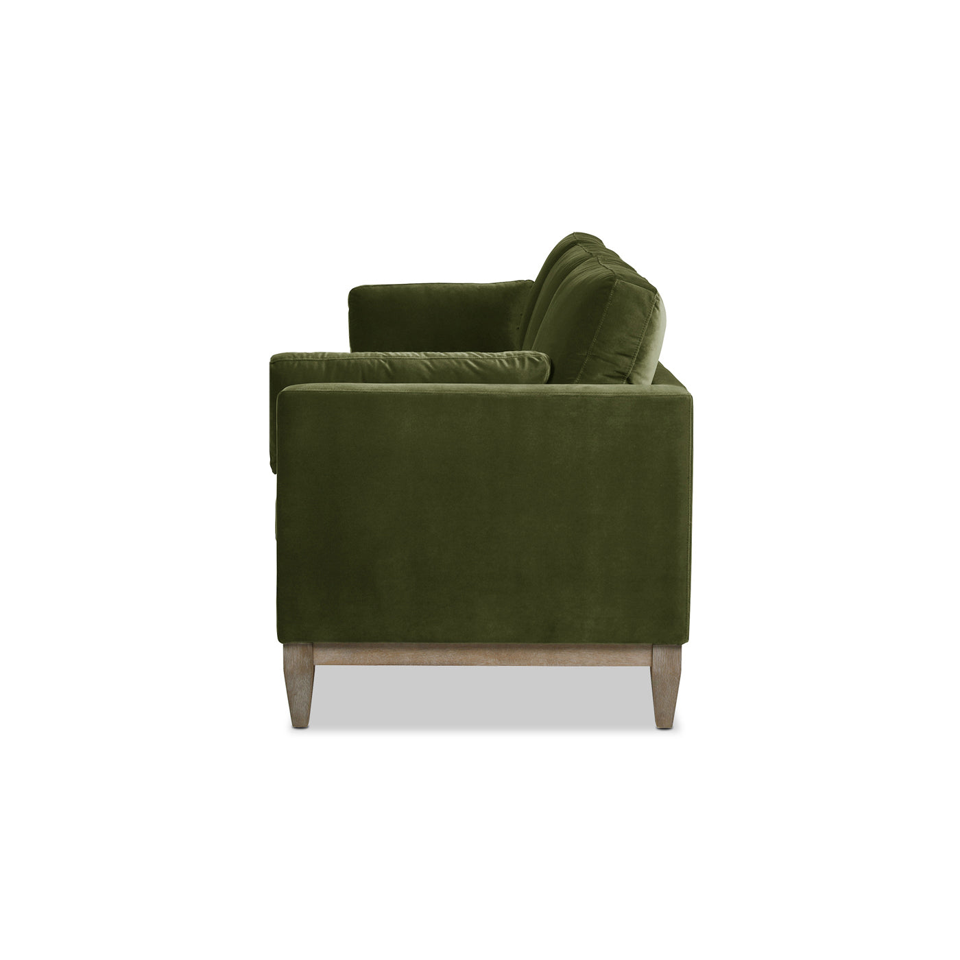 Deep green velvet sofa with plush cushions and light wood legs